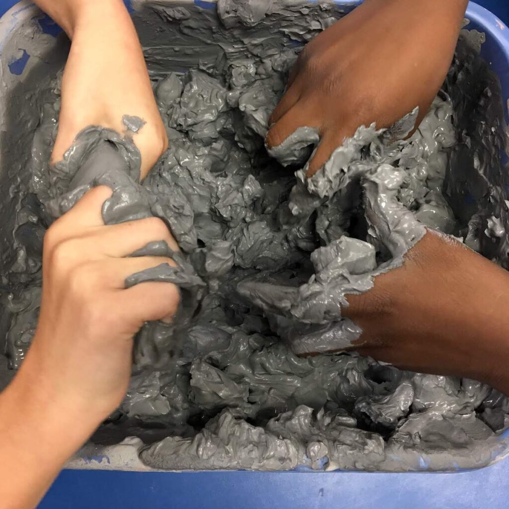 breaking clay into lumps