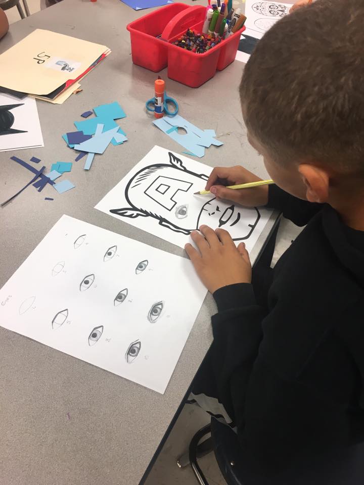 student working on drawing