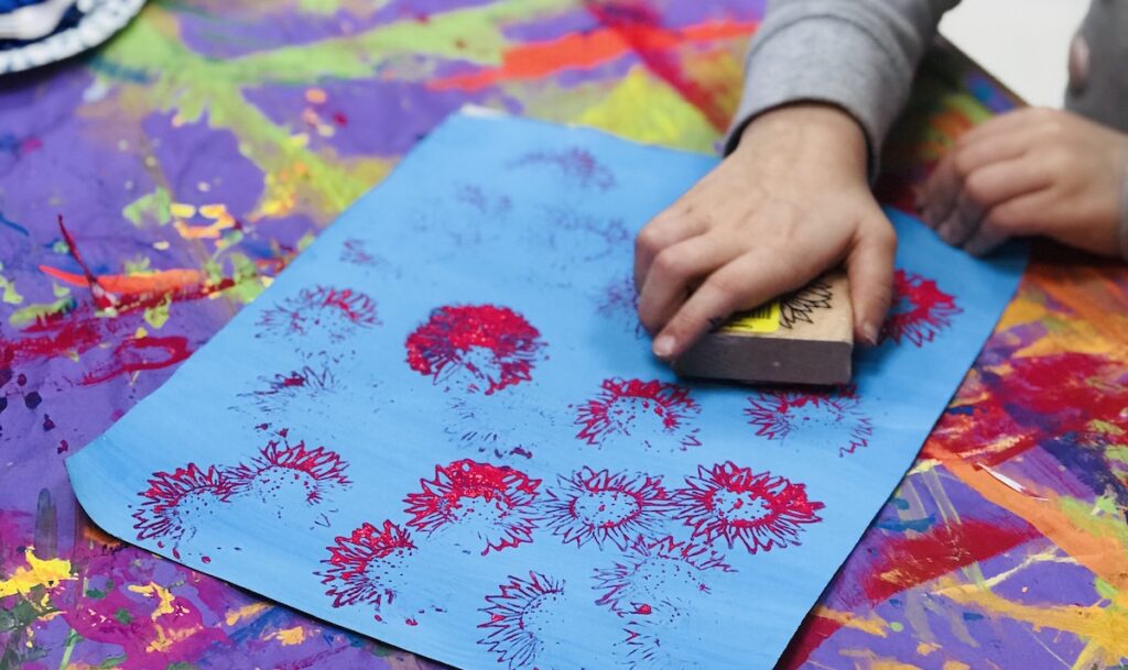 Student making marks on paper