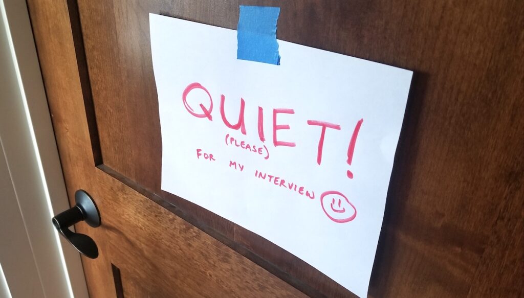 door with sign saying "quiet!"