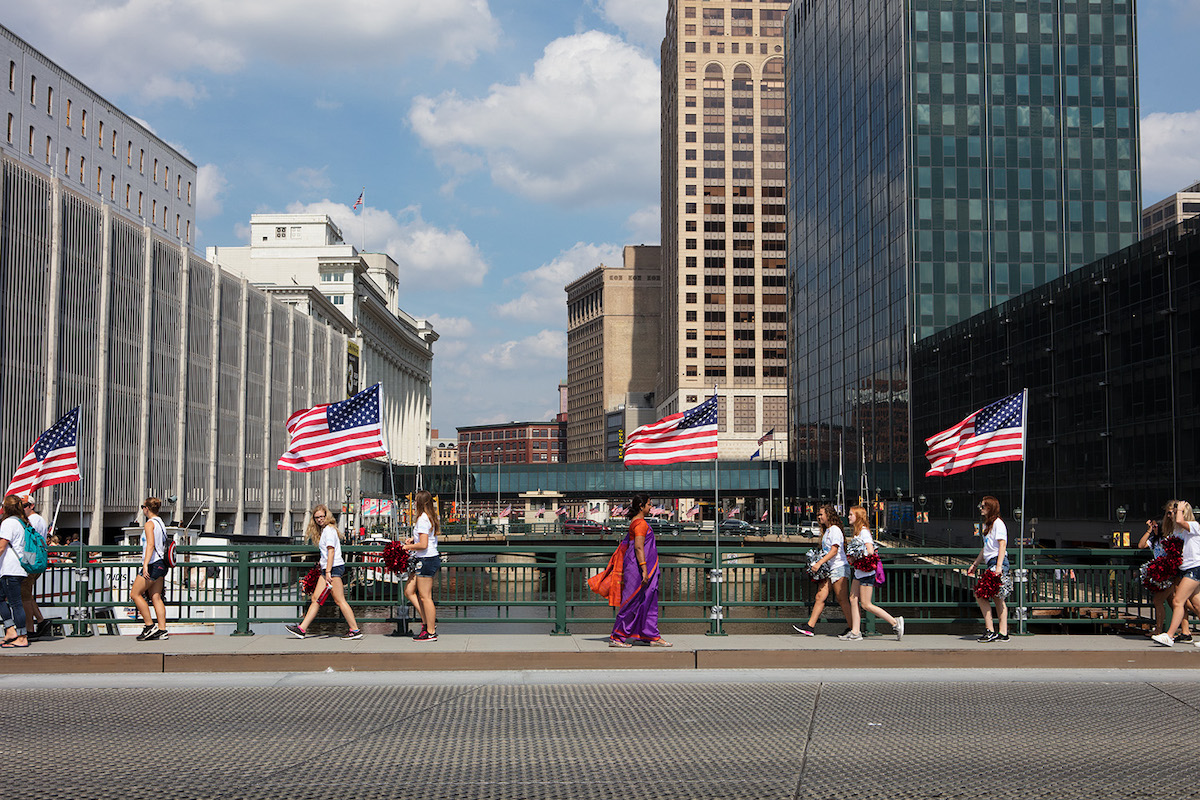 photograph of woman in a sari walking in downtown chicago
