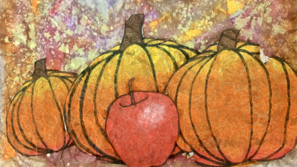 artwork with pumpkins using oil pastel batik technique