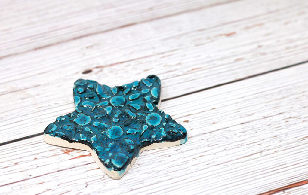 star with blue and green glaze and texture