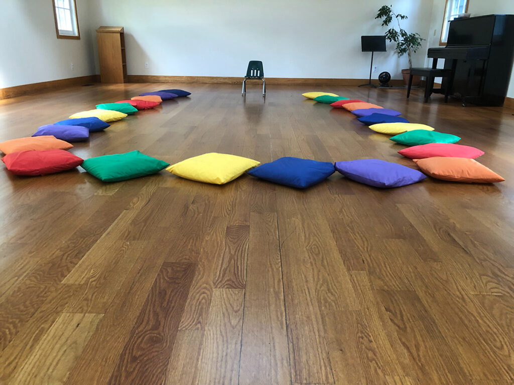 colored cushions on the floor for storytime