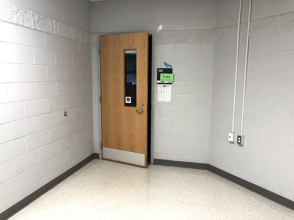 empty school hallway and door