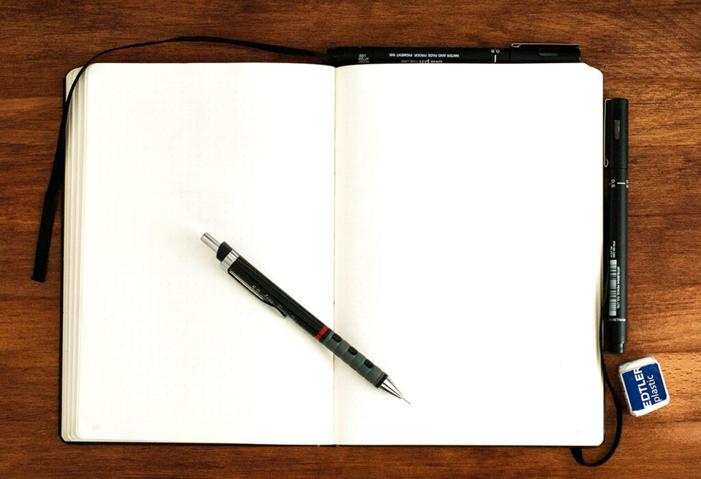 blank sketchbook with pen