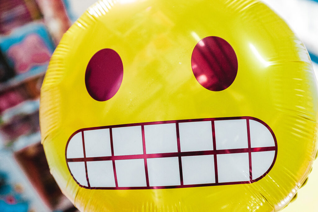balloon with grimace emoji