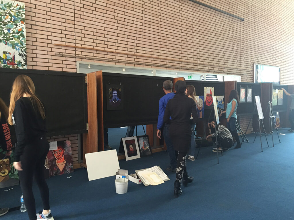 students setting up an exhibition