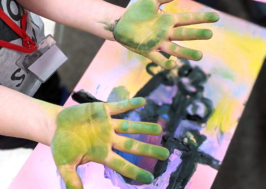 hands with paint